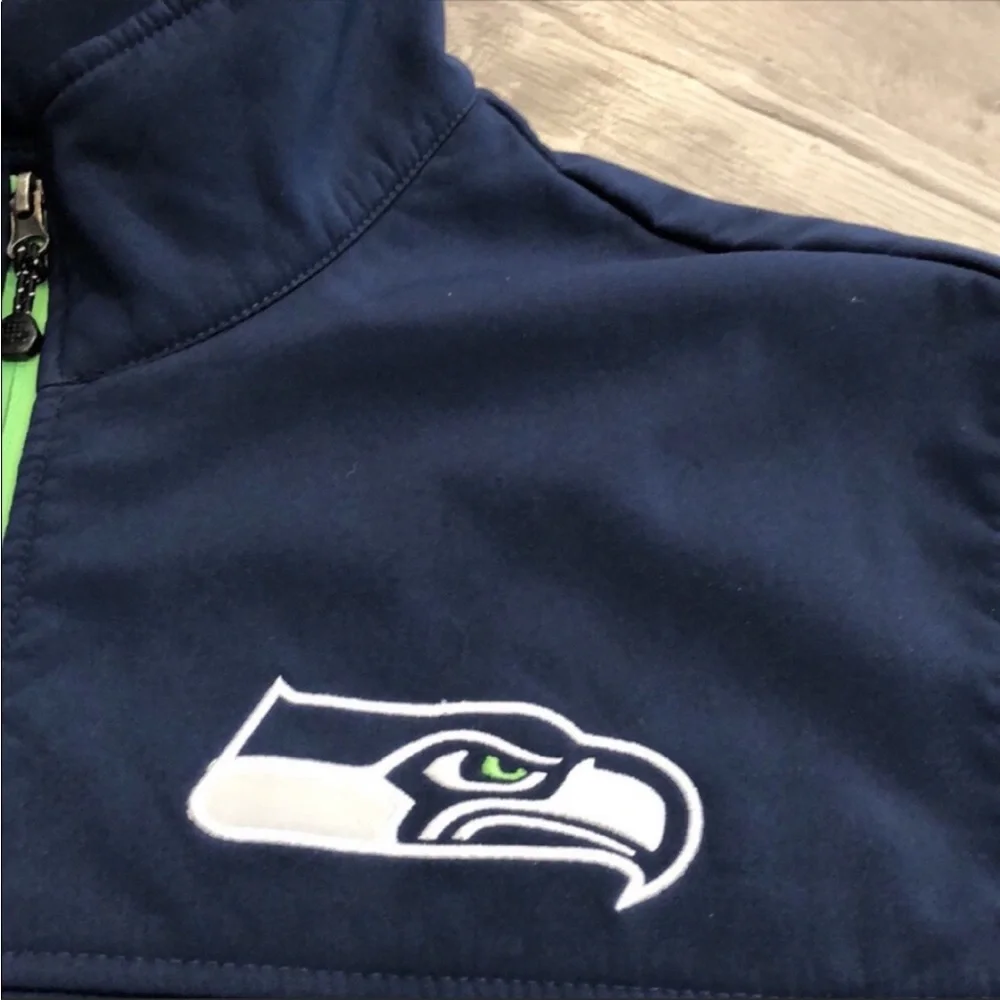 SEATTLE SEA-HAWKS NAVY FULL ZIP 3 LAYER BONDED HANDS HIGH SOFTSHELL JACK…
